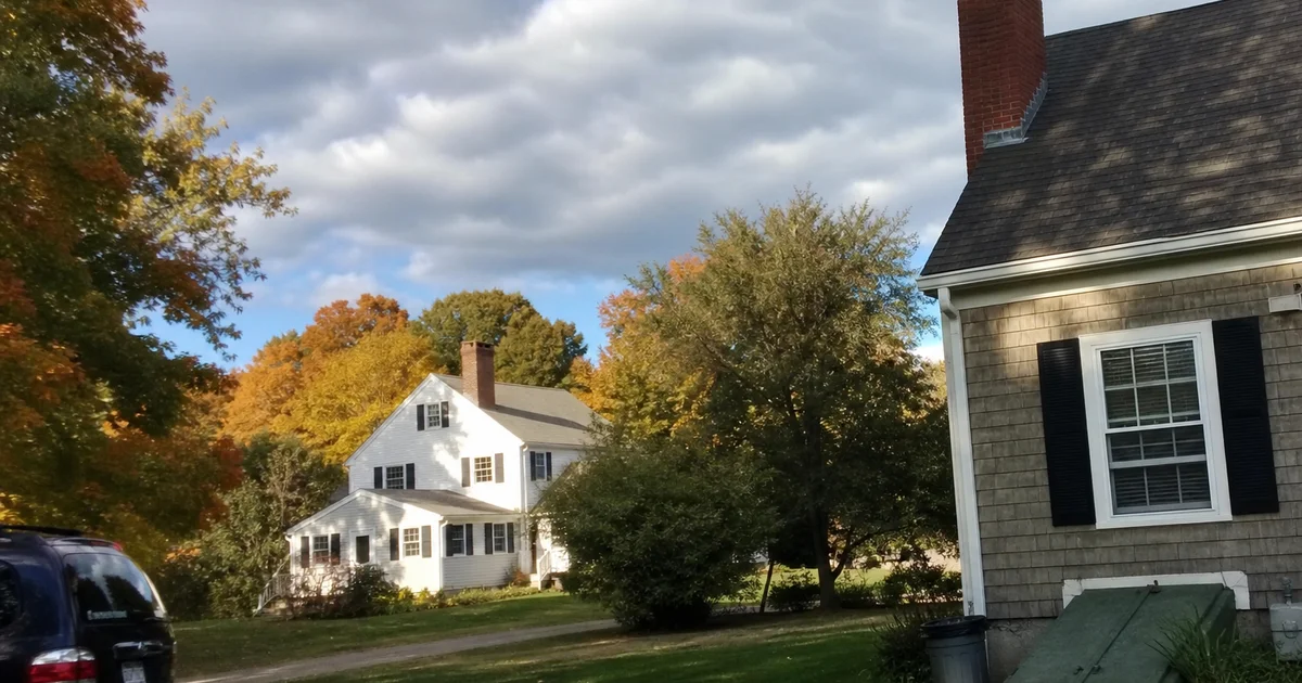 Central Connecticut homes with brick chimneys as autumn leaves begin to turn