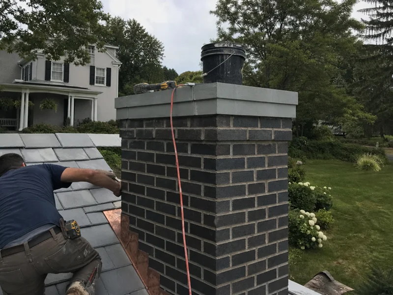 Decorative bluestone chimney top on a historic colonial home