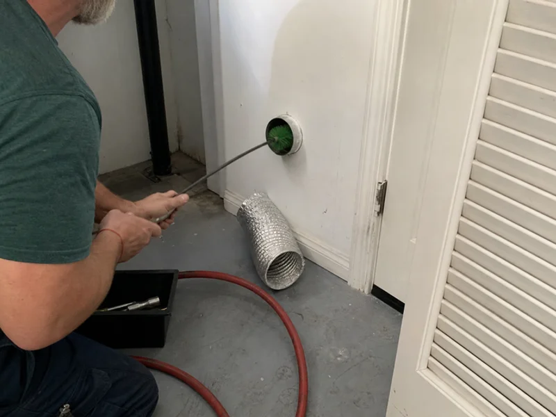 Rotating dryer vent brush extended into a duct run