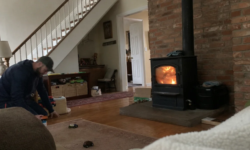 Cozy living room with a wood stove burning