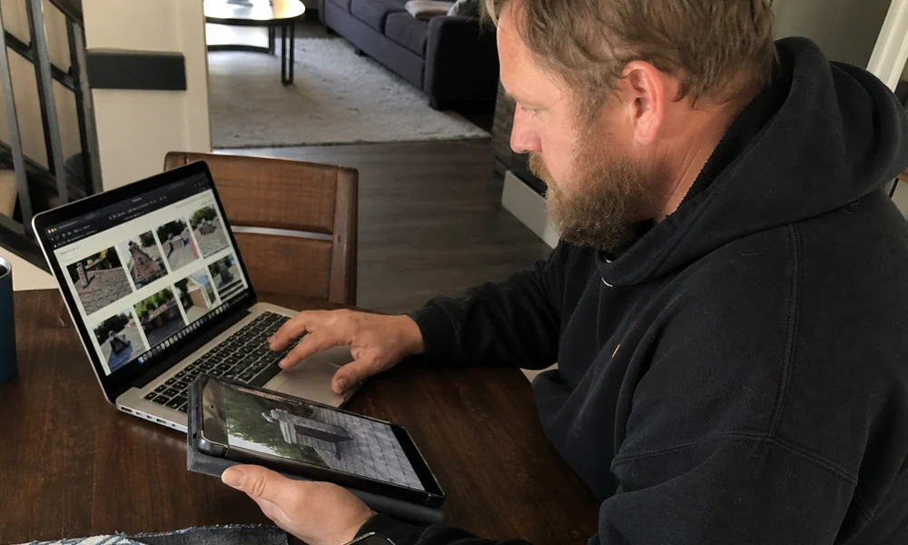 CSIA technician reviewing chimney photos for a virtual quote