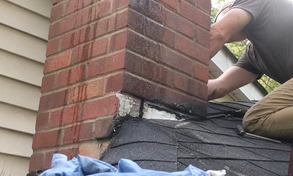 Rain running down a chimney with failed flashing at the roofline